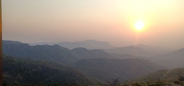 Scenic view of mountains against sky during sunset