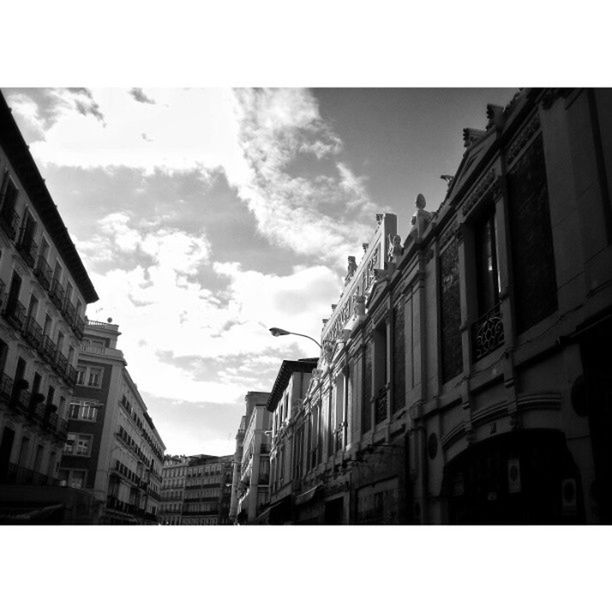 building exterior, architecture, built structure, transfer print, sky, auto post production filter, city, residential structure, building, residential building, low angle view, cloud - sky, window, cloud, outdoors, residential district, day, house, no people, city life