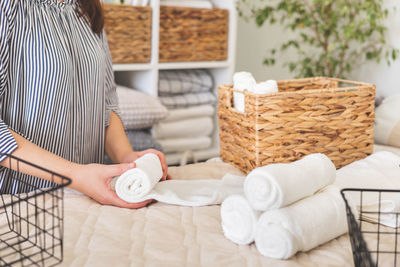 Midsection of woman holding wicker basket