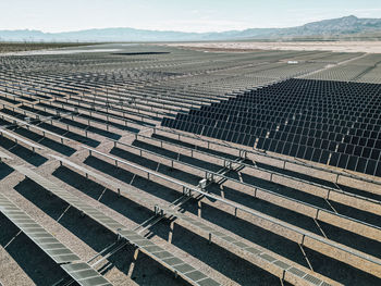 Renewable solar energy solar farm in the desert of southern nevada on a dry lake bed.