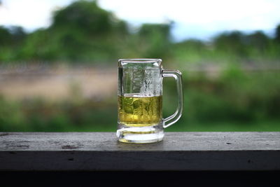 Close-up of beer glass on table