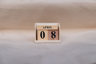 Close-up of information sign on table