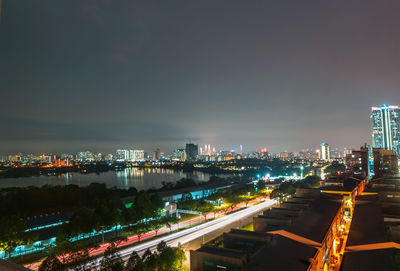 High angle view of illuminated buildings in city at night