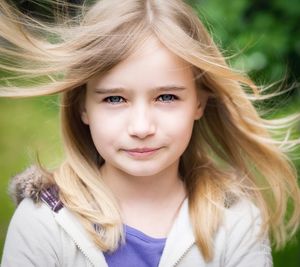 Close-up portrait of girl with tousled hair