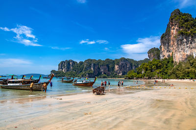 Scenic view of beach against blue sky