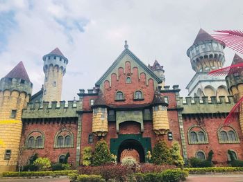 Low angle view of old building against sky