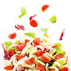 Close-up of salad served on white background