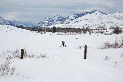 Scenic view of snow covered mountains against sky