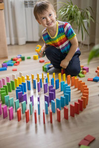 Boy playing with toys on table