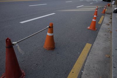 High angle view of arrow sign on road in city