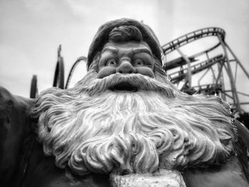 Low angle view of santa claus statue at amusement park