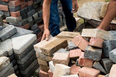 Low angle view of men working at construction site