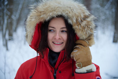 Portrait of young woman wearing warm clothes
