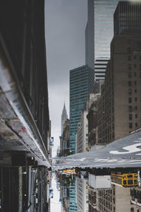 Modern buildings in city against sky