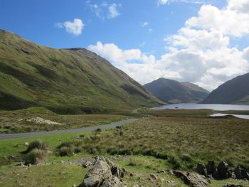 Scenic view of landscape and mountains against sky