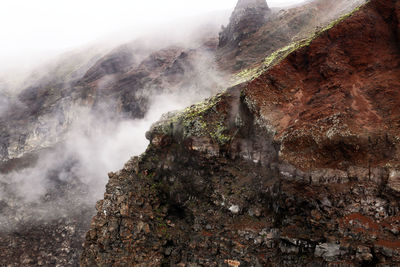 Scenic view of mountain during foggy weather