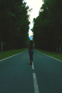 Woman walking on road