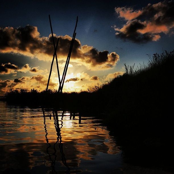 sunset, water, silhouette, sky, tranquility, tranquil scene, scenics, reflection, beauty in nature, cloud - sky, lake, nature, idyllic, waterfront, cloud, orange color, dramatic sky, tree, calm, rippled