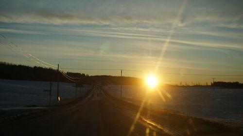 Road against sky during sunset