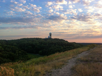 Scenic view of landscape against cloudy sky
