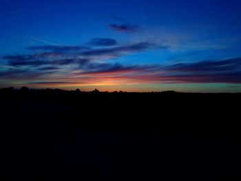 Scenic view of silhouette landscape against sky during sunset