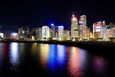 Illuminated city at waterfront