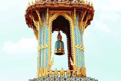 Low angle view of bell tower at grand palace against sky