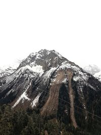 Scenic view of snow mountains against clear sky