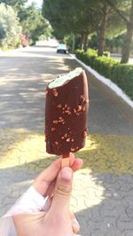 Close-up of woman holding ice cream cone