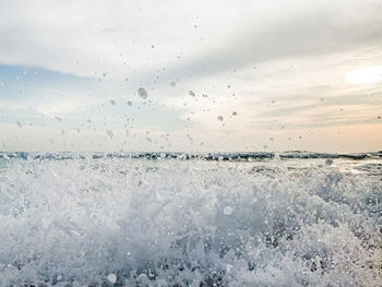 Scenic view of sea against sky during winter