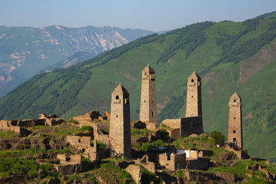 Old ruins of building against mountains