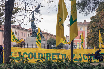 Yellow buildings against sky in city