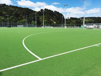 Playing field against cloudy sky