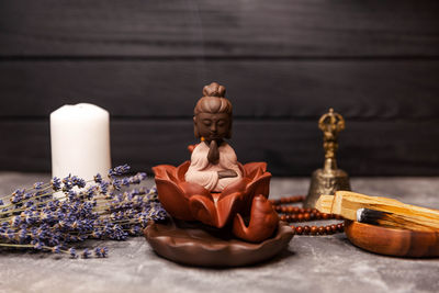 Picture of a modern interior in oriental style, smoking incense sticks