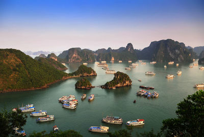 High angle view of boats in sea against clear sky