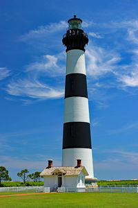 Low angle view of lighthouse against blue sky