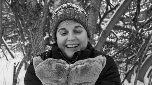 Portrait of smiling young woman in winter