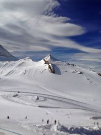 Snow on landscape against sky