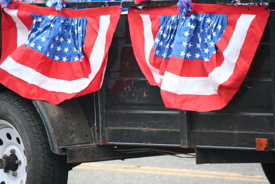 American flag on vehicle trailer during independence day parade