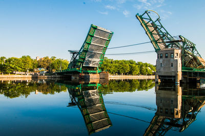 Built structure by lake against sky