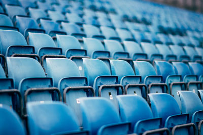 Full frame shot of empty blue seats in stadium