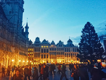 Group of people in front of building at night