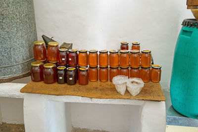 Close-up of bottles against wall