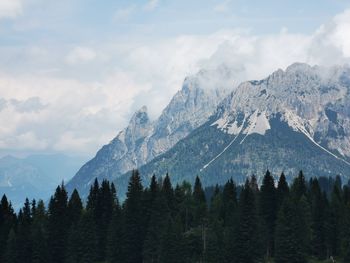 Scenic view of mountains against cloudy sky