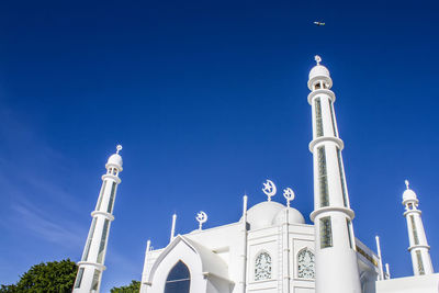 Low angle view of building against blue sky
