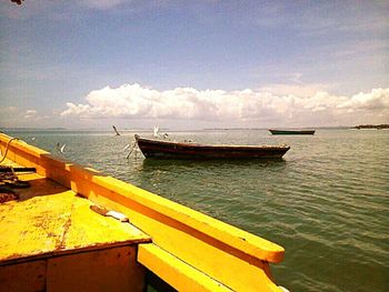 Scenic view of sea against cloudy sky