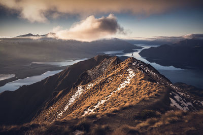 Aerial view of mountains against sky during sunset