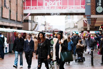 People walking on street in city