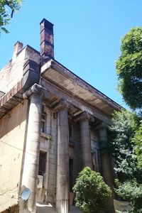 Low angle view of old building against clear sky