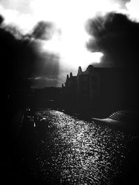 View of buildings against cloudy sky